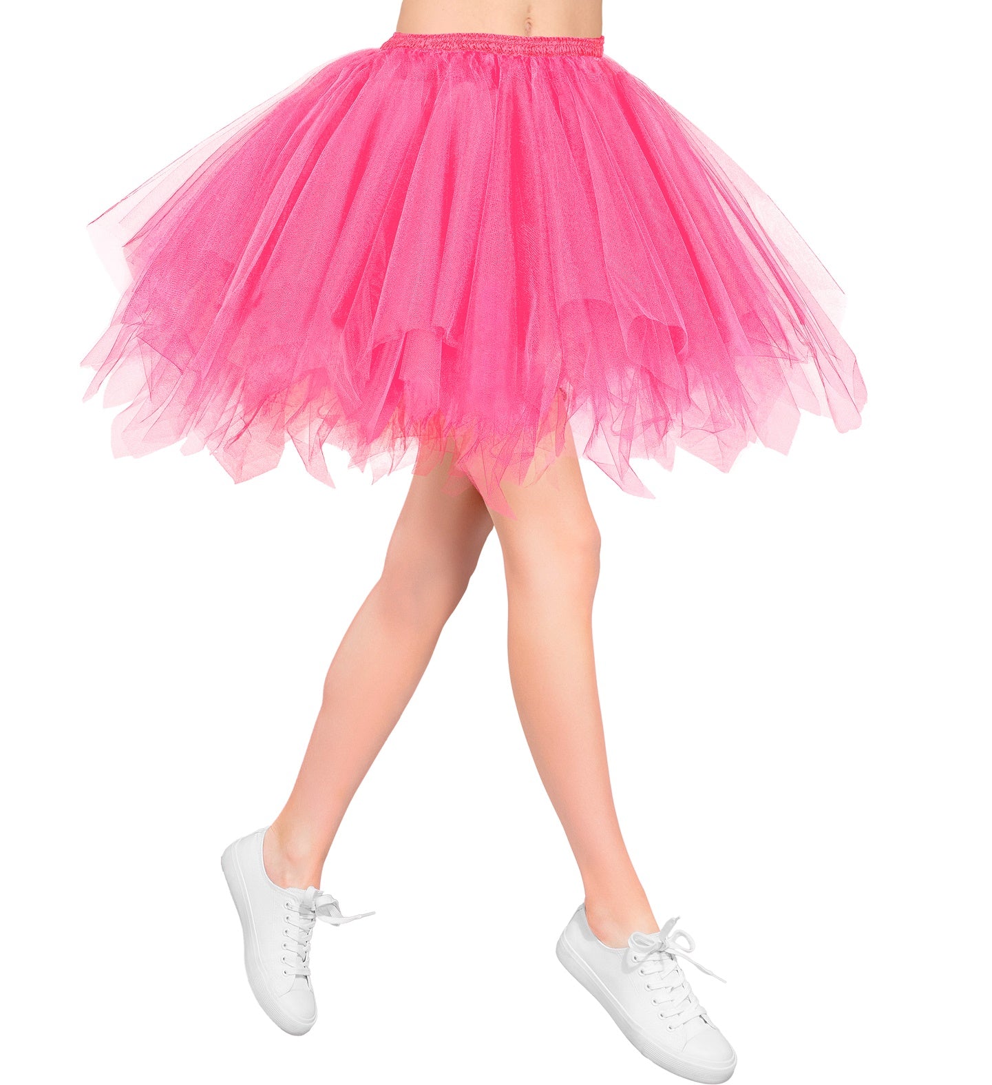 Woman's legs wearing a short, fluffy neon pink tutu skirt with white trainers.