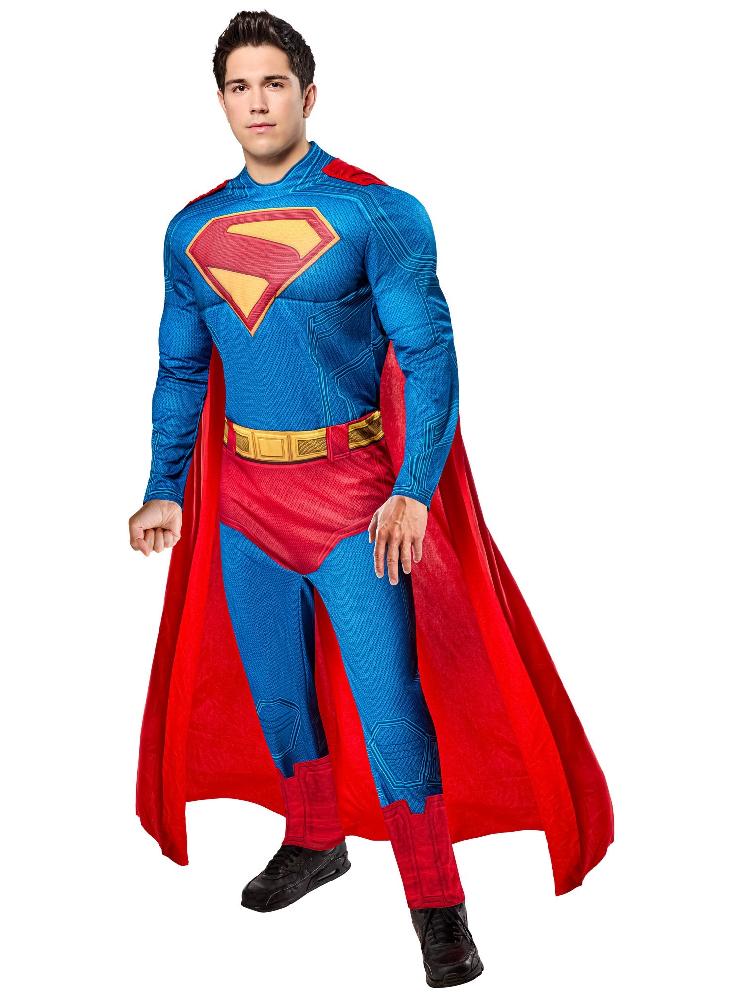 A person in a 2025 full-body Superman costume, including a blue and red padded jumpsuit with the iconic "S" emblem and a red cape, posing heroically.