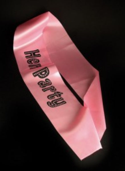 A pink sash with 'Hen Party' text printed in black, designed for use as a costume accessory.